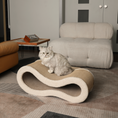 Load image into Gallery viewer, Cat lounging on a beige cloud lounge cat scratcher in a modern living room.